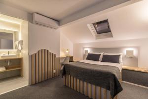 Ένα ή περισσότερα κρεβάτια σε δωμάτιο στο FastHôtel Biarritz Bidart Côte-Basque - Un hôtel FH Collection