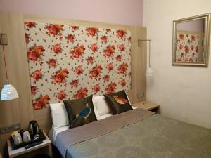 Posteľ alebo postele v izbe v ubytovaní Hotel Ginebra