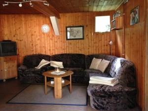 a living room with a couch and a table at Reiterhof Winandy in Wietzendorf