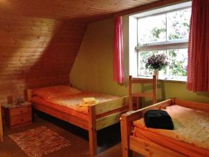 a bedroom with two bunk beds in a attic at Reiterhof Winandy in Wietzendorf