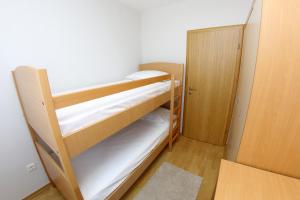 Postel nebo postele na pokoji v ubytování Lila Apartments