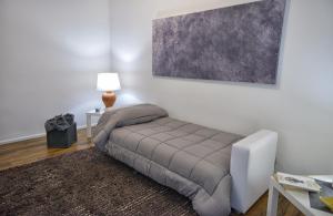 Un pat sau paturi într-o cameră la Maison Sama '