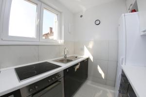 Kuchyň nebo kuchyňský kout v ubytování Lila Apartments