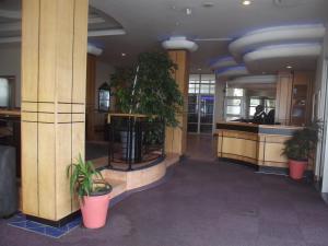 a hallway with potted plants in a building at Strand Beach Road Unit 416 in Strand