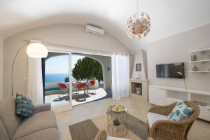 a living room with a view of the ocean at Casa Giovannina in Conca dei Marini