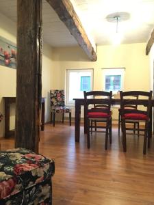 a dining room with a table and chairs at Ferienhaus Harzinsel in Wernigerode