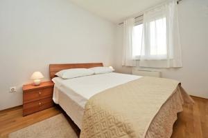 Postel nebo postele na pokoji v ubytování Lila Apartments