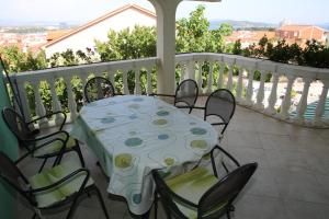 a table and chairs on a balcony with a view at Apartments Katarine Zrinske in Vodice