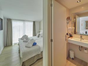 Postel nebo postele na pokoji v ubytování Paguera Treff Boutique Hotel