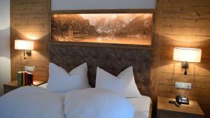 Uma cama ou camas num quarto em Hotel Trenker