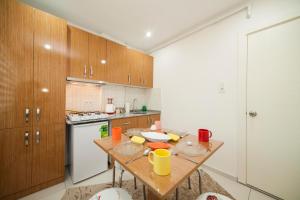 A kitchen or kitchenette at Zengin City Hotel