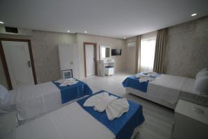 Giường trong phòng chung tại Hotel Aksaray
