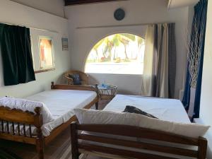 Ένα ή περισσότερα κρεβάτια σε δωμάτιο στο Airy Dale Villa and Guesthouse