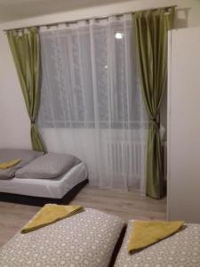 Postel nebo postele na pokoji v ubytování Apartmán Hugo