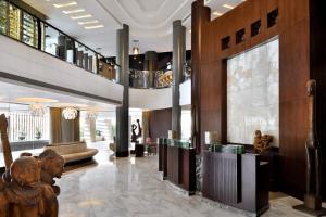a lobby of a hotel with a large lobby at Sankara Nairobi, Autograph Collection in Nairobi
