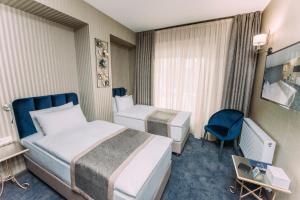 Voodi või voodid majutusasutuse Hotel Sapphire Bakuriani toas