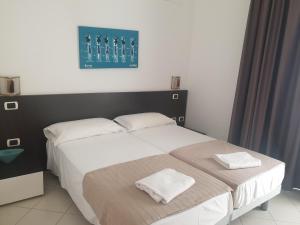 Postel nebo postele na pokoji v ubytování Aparthotel Por do Sol