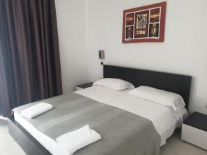 Postel nebo postele na pokoji v ubytování Aparthotel Por do Sol