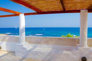 a view of the ocean from a beach house at Casa Acquamarina in Villanova di Ostuni