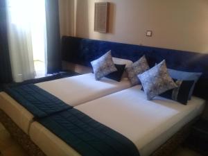 Postel nebo postele na pokoji v ubytování Hotel Batha