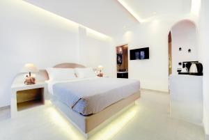 Łóżko lub łóżka w pokoju w obiekcie Emerald Collection Suites