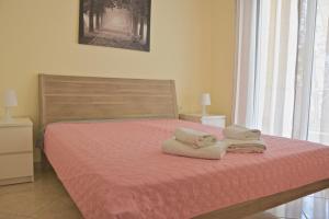 Postel nebo postele na pokoji v ubytování Alex Superior Apartment
