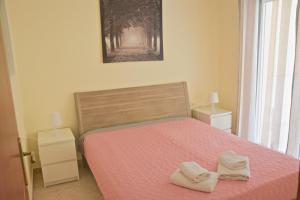 Postel nebo postele na pokoji v ubytování Alex Superior Apartment