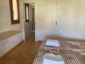 a room with two beds with towels on them at Locanda FarOrientale in Santa Lucia +69 photos