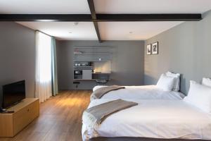 Cama o camas de una habitación en Hostellerie du Grünewald