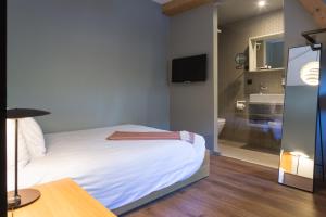 Cama o camas de una habitación en Hostellerie du Grünewald