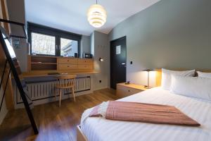 Cama o camas de una habitación en Hostellerie du Grünewald