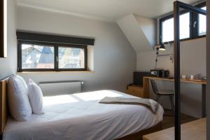 Cama o camas de una habitación en Hostellerie du Grünewald