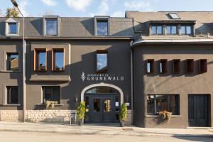 a building with the entrance to a german grammar wall at Hostellerie du Grünewald in Luxembourg