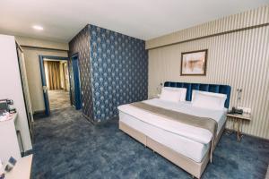 Voodi või voodid majutusasutuse Hotel Sapphire Bakuriani toas