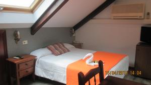 Łóżko lub łóżka w pokoju w obiekcie Hotel Playa Samil Vigo