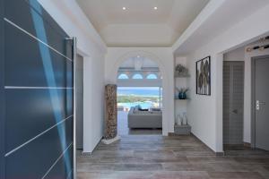 a hallway with a glass door leading to a living room at Dream Villa Orient Bay 566 in Orient Bay