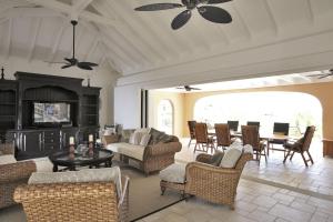 a living room with couches and chairs and a fireplace at Dream Villa Terres Basses 543 in Les Terres Basses