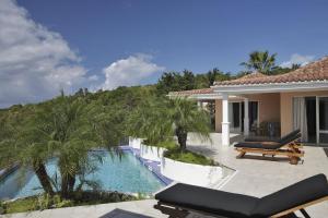 a villa with a swimming pool and a house at Dream Villa Terres Basses 543 in Les Terres Basses