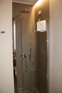 a shower in a bathroom with a glass shower stall at ARIA Design B&B Levanto in Levanto
