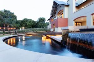 a water fountain in front of a building at The Rasmus in Pretoria