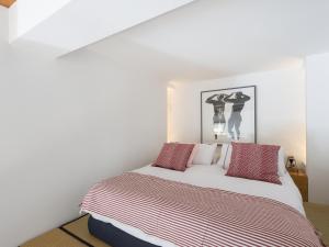 Posteľ alebo postele v izbe v ubytovaní Loft in Trastevere