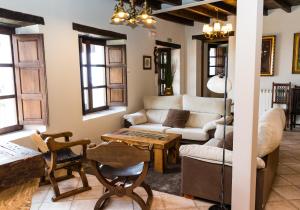 a living room with a couch and a table at Casa de Aldea el Navaron in Cofiño
