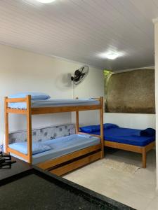 Postel nebo postele na pokoji v ubytování Flats Alto das Pedras