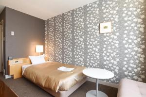 Postelja oz. postelje v sobi nastanitve Hotel Grand Vert Gizan