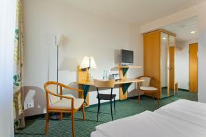 TV a/nebo společenská místnost v ubytování HKK Hotel Wernigerode + 36 fotografií