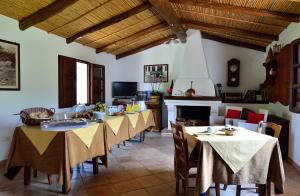 a group of tables in a living room at Agriturismo Guthiddai in Oliena