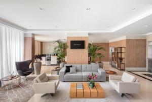 a living room with a couch and a table at Intercity Sao Leopoldo in São Leopoldo