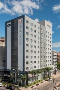 a hotel with a sign on the front of it at Intercity Sao Leopoldo in São Leopoldo