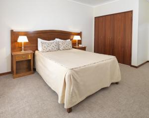 Cama ou camas em um quarto em Hotel Santa Maria