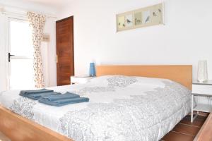 Кровать или кровати в номере Casa Bom apartamentos